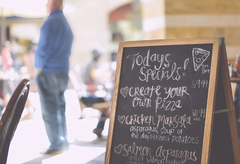Italian specials chalkboard standing near a cafe entrance