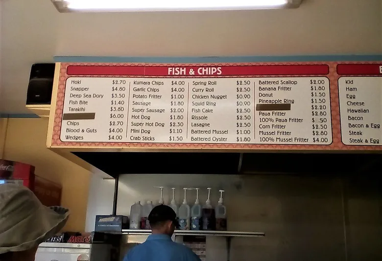 Takeaway shop wall menu above the kitchen counter